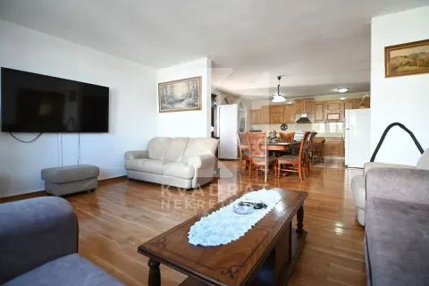 Spacious living room connected to the dining area and kitchen. - image 6