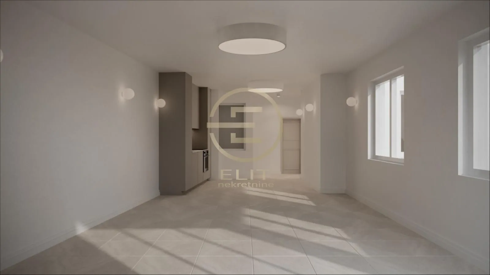 View of the kitchen area in a modern apartment with tiled flooring.