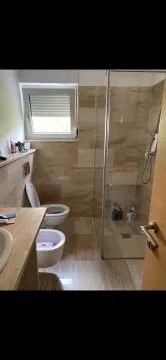 Modernly equipped bathroom with a walk-in shower. - image 2