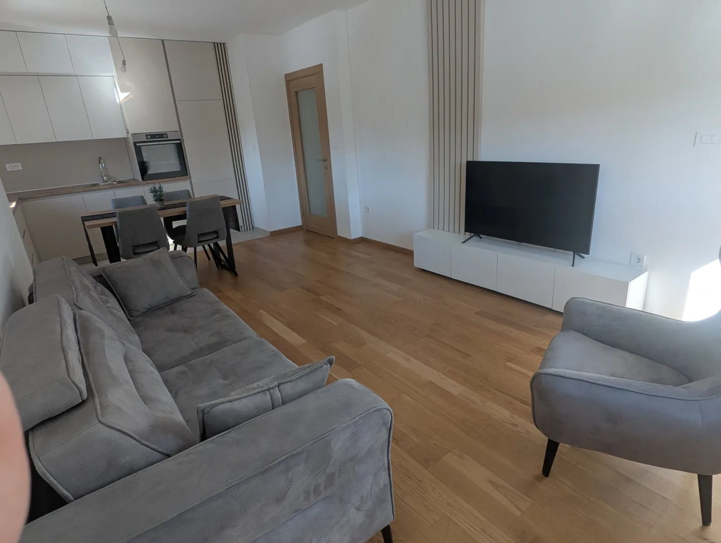 Spacious living room connected to the dining area and kitchen.