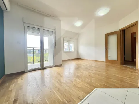 Empty room with hardwood floors and balcony access. - image 3