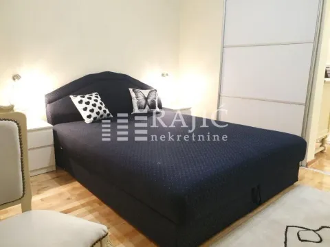 Furnished bedroom with a double bed. - image 10