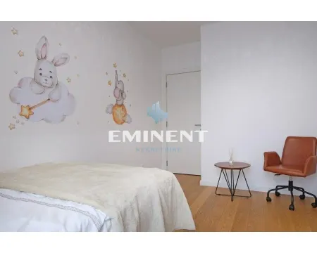Children's bedroom with a bed, desk, and wall stickers. - image 12