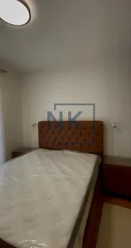 Furnished bedroom with a double bed and nightstands. - image 7