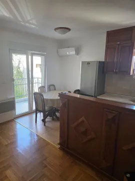 Kitchen with dining area and access to the terrace. - image 5