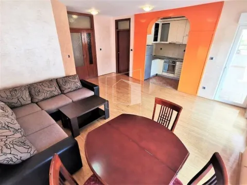 Living room with sofa set and dining table, overlooking the kitchen. - image 3