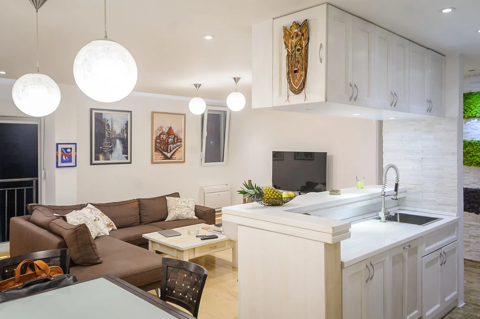 Open plan space with a kitchen and living room.