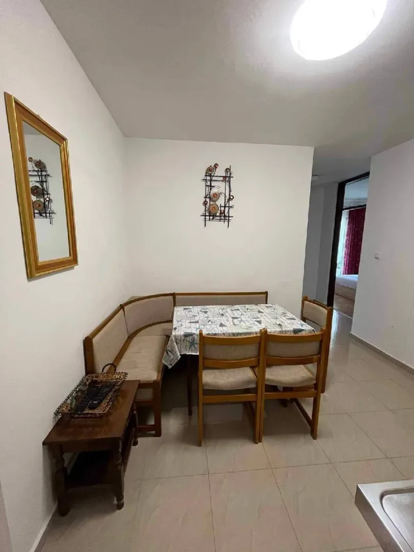 Dining area with a corner bench, table, and chairs.