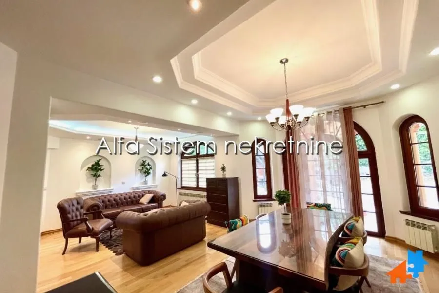 Spacious living room with a dining area and sofa set.