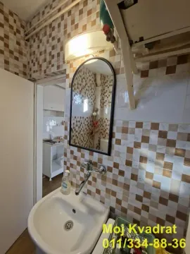 Small bathroom with a sink and a mirror. - image 15