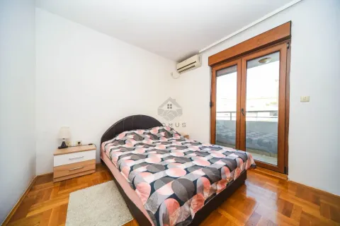 Bedroom with a double bed, bedside table, and access to the terrace. - image 8