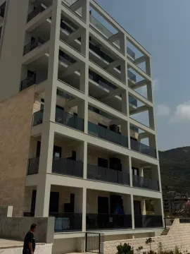 Exterior view of a modern apartment building with balconies. - image 9