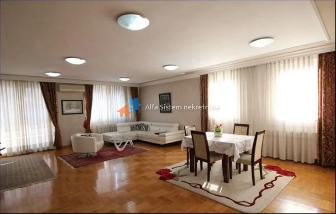 Spacious living room with a seating area and a dining table.