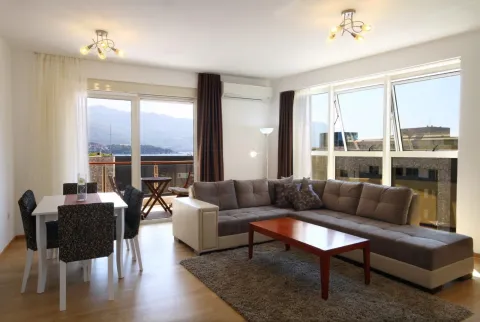 Spacious living room with sofa, dining area, and access to a terrace with sea views. - image 7