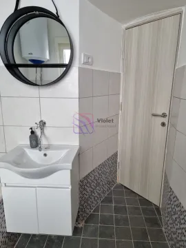 Bathroom with a washbasin, mirror and a door. - image 16