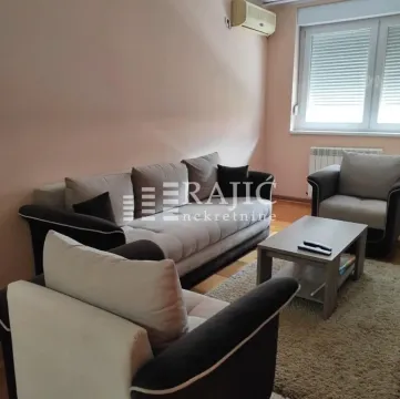 Living room furnished with a seating set and a coffee table. - image 2