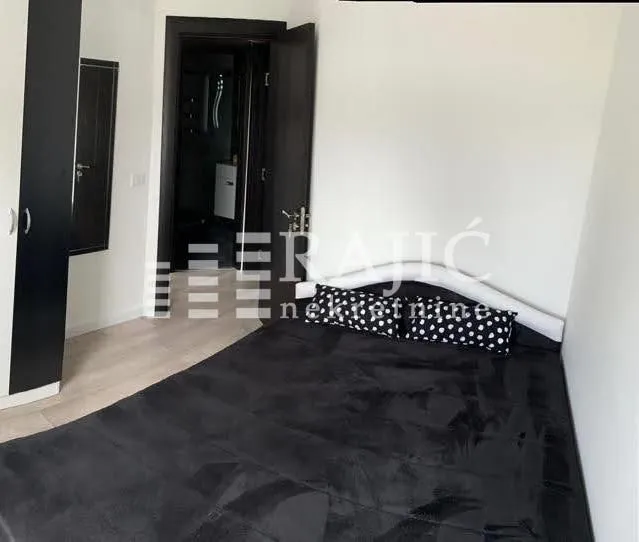 Bedroom with a large double bed and wardrobe.