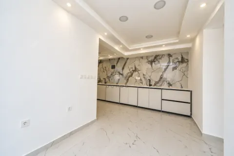 Modern kitchen with marble backsplash and built-in units. - image 9