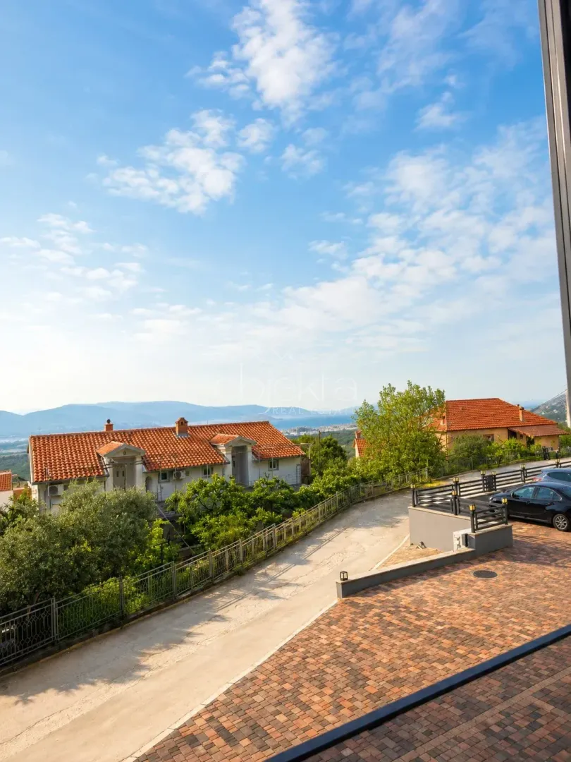View from the terrace towards the surrounding houses and landscape.