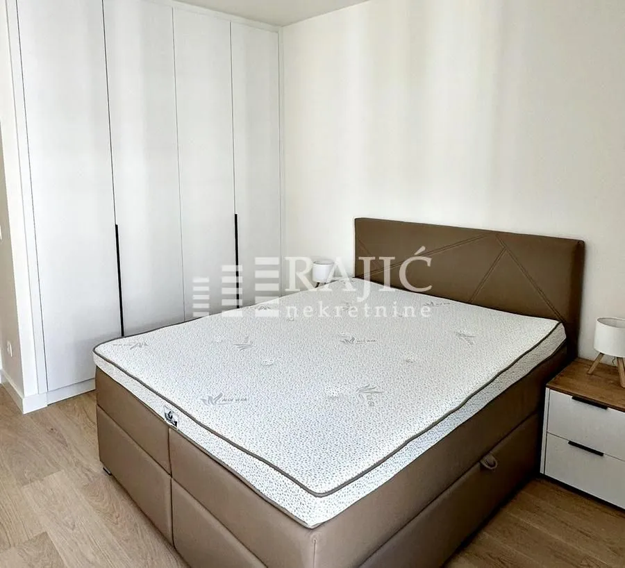 Bedroom with a double bed and built-in wardrobe.