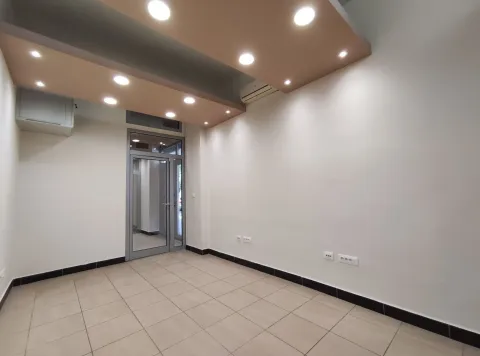 Empty room with modern recessed ceiling lights and tiled flooring. - image 2