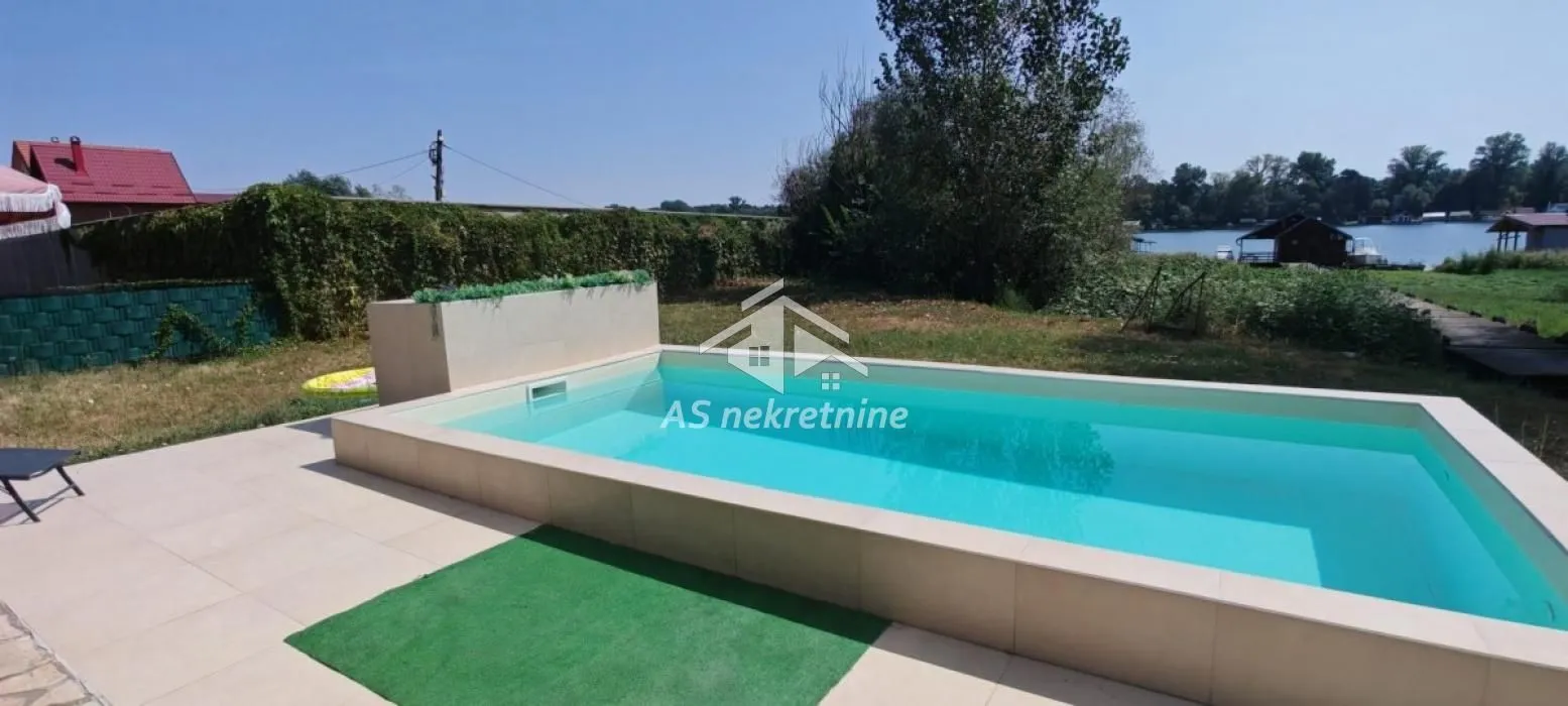 Swimming pool in the courtyard with a river view.