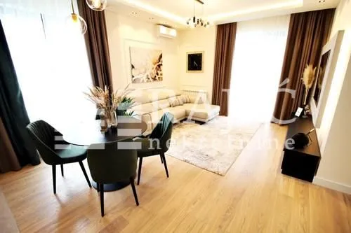 Living room with dining area and modern furniture.