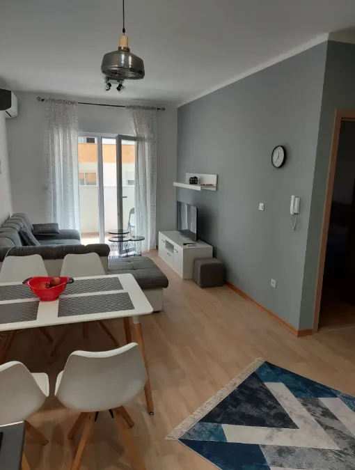 Living room connected with the dining area and access to the terrace.