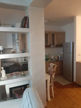 View of the kitchen and dining area through a decorative partition. - image 16