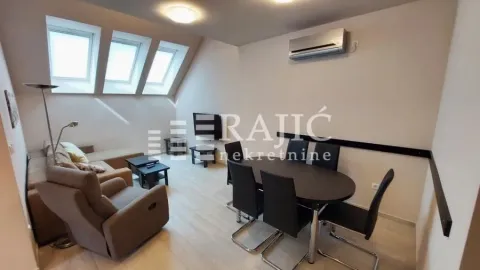 Spacious living room with dining area and skylights in the attic. - image 3