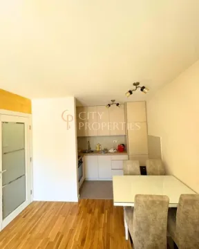 Small kitchen with a dining table and chairs. - image 5