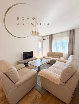 Bright living room with seating set and TV cabinet. - image 4