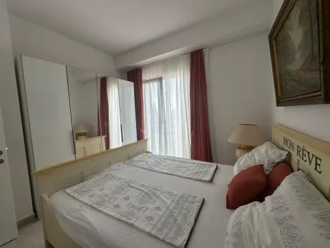 Furnished bedroom with a double bed, wardrobe, and terrace access. - image 11