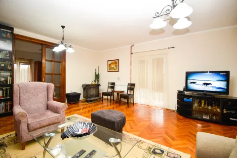 Living room with furniture, a TV, and parquet flooring. - image 8