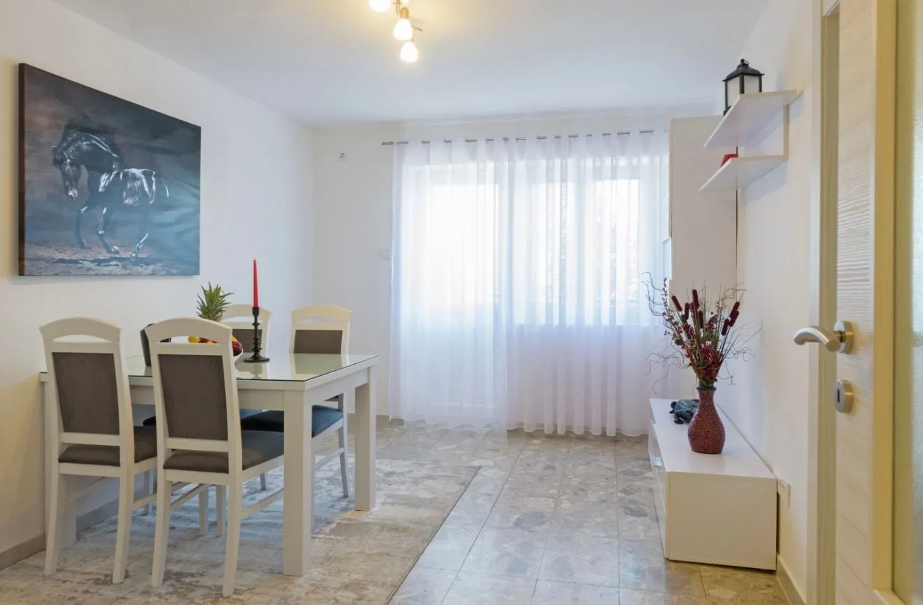 Living room with a dining table and chairs.