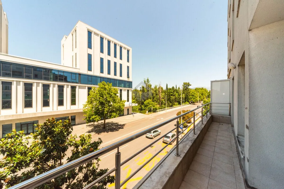 View from the balcony overlooking the street and surrounding buildings.