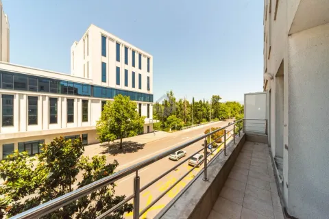 View from the balcony overlooking the street and surrounding buildings. - image 9