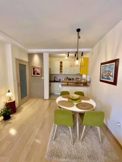 Dining area with a view of the kitchen in the apartment.