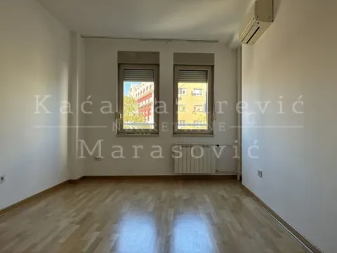 Empty room with parquet flooring and an air conditioning unit on the wall. - image 14