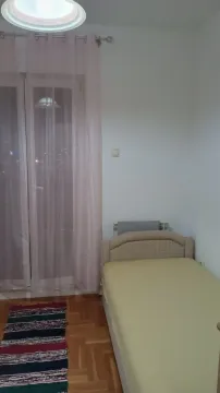 Simple bedroom with a single bed. - image 7