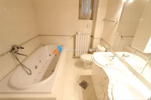 Bathroom equipped with a bathtub, washbasin, and toilet. - image 21