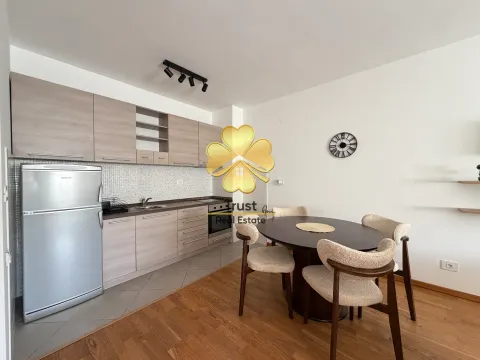 Modern kitchen with a dining area and wooden elements. - image 4