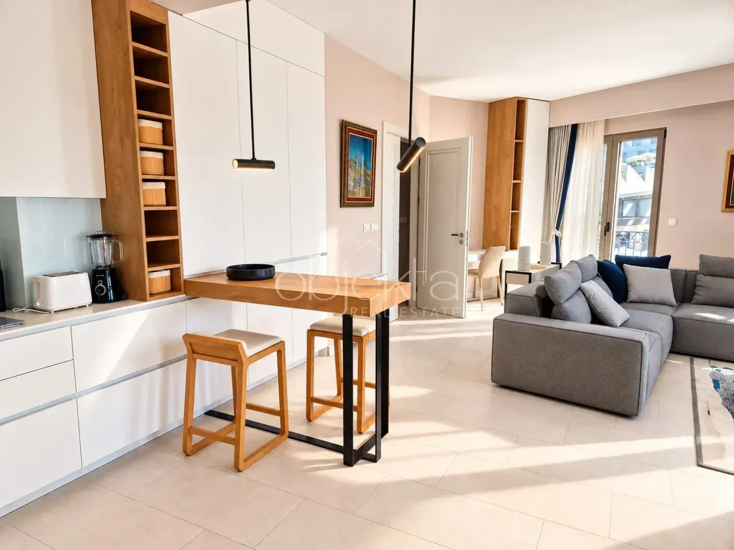 Modern living room with kitchen and dining bar in an open space layout.