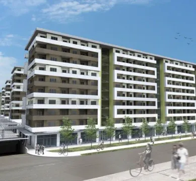 Exterior view of the residential building with balconies and a sidewalk in front. - image 7