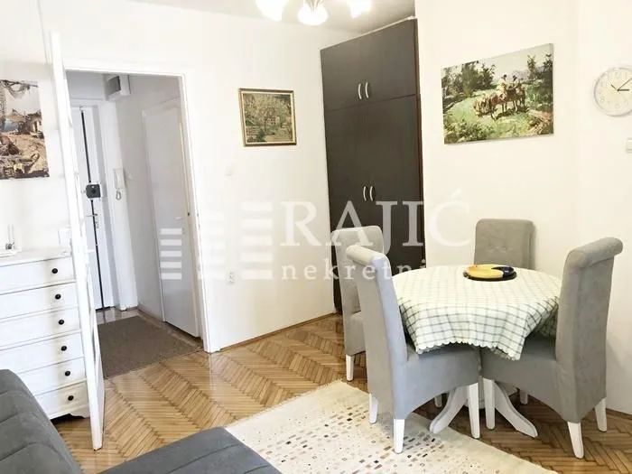 Living room with a dining table and chairs.