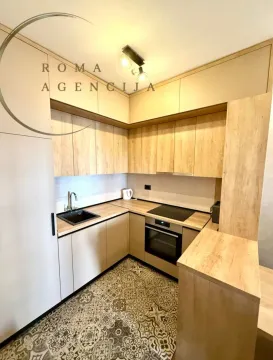 Modern kitchen with wooden elements and built-in appliances. - image 2