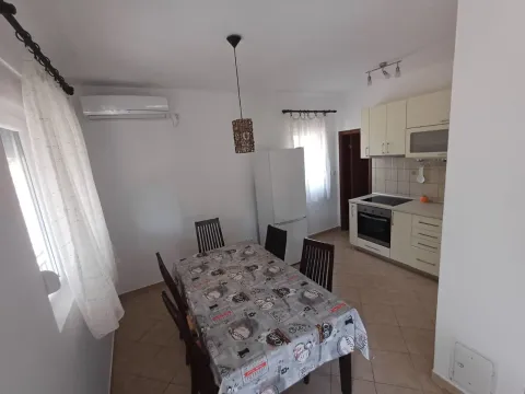 Kitchen with dining area and appliances. - image 5