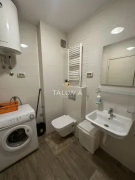 Bathroom equipped with sanitary ware, washbasin, shower cabin and washing machine. - image 8