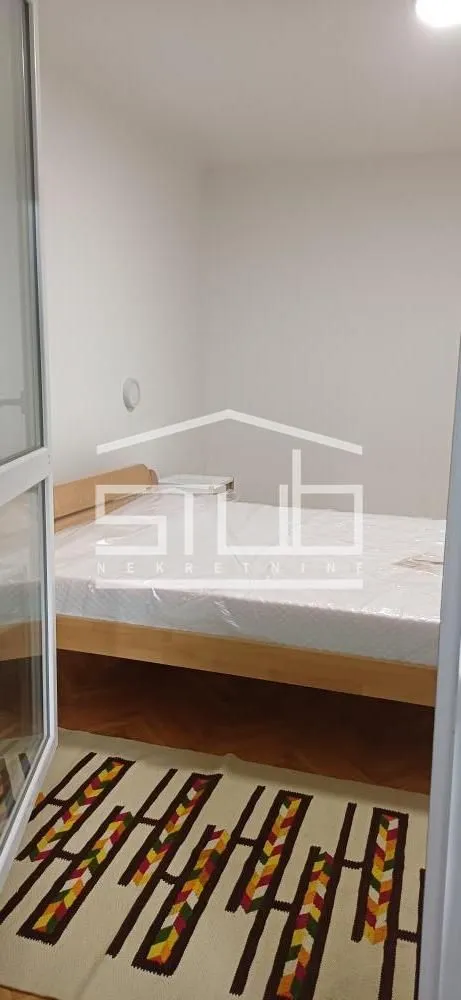 View of the bedroom with a bed.