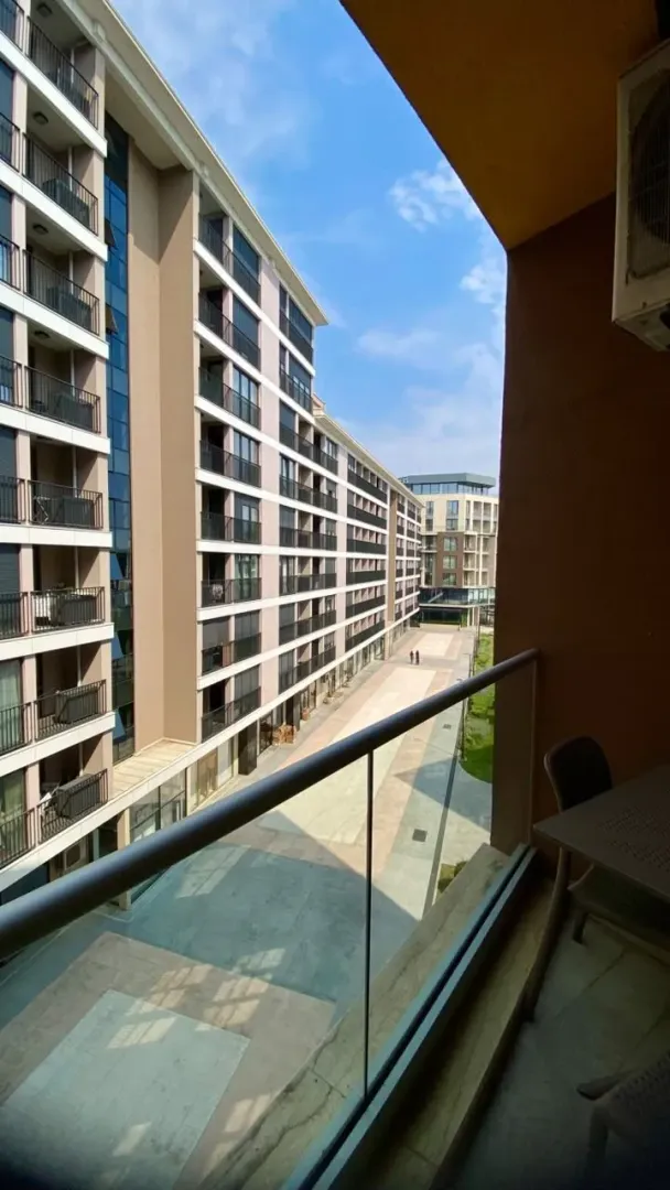 View from the balcony overlooking the buildings and courtyard of the complex.